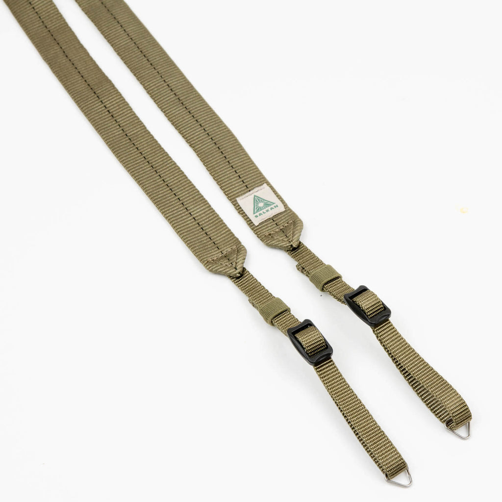 Salkan camera strap in olive green, flat lay showing both adjustable ends with buckles and hooks