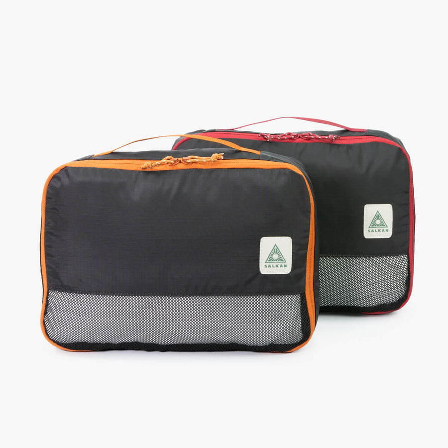 Salkan Packing Cube Set of 2 in ripstop nylon, orange and red trimmed mesh-top cubes together